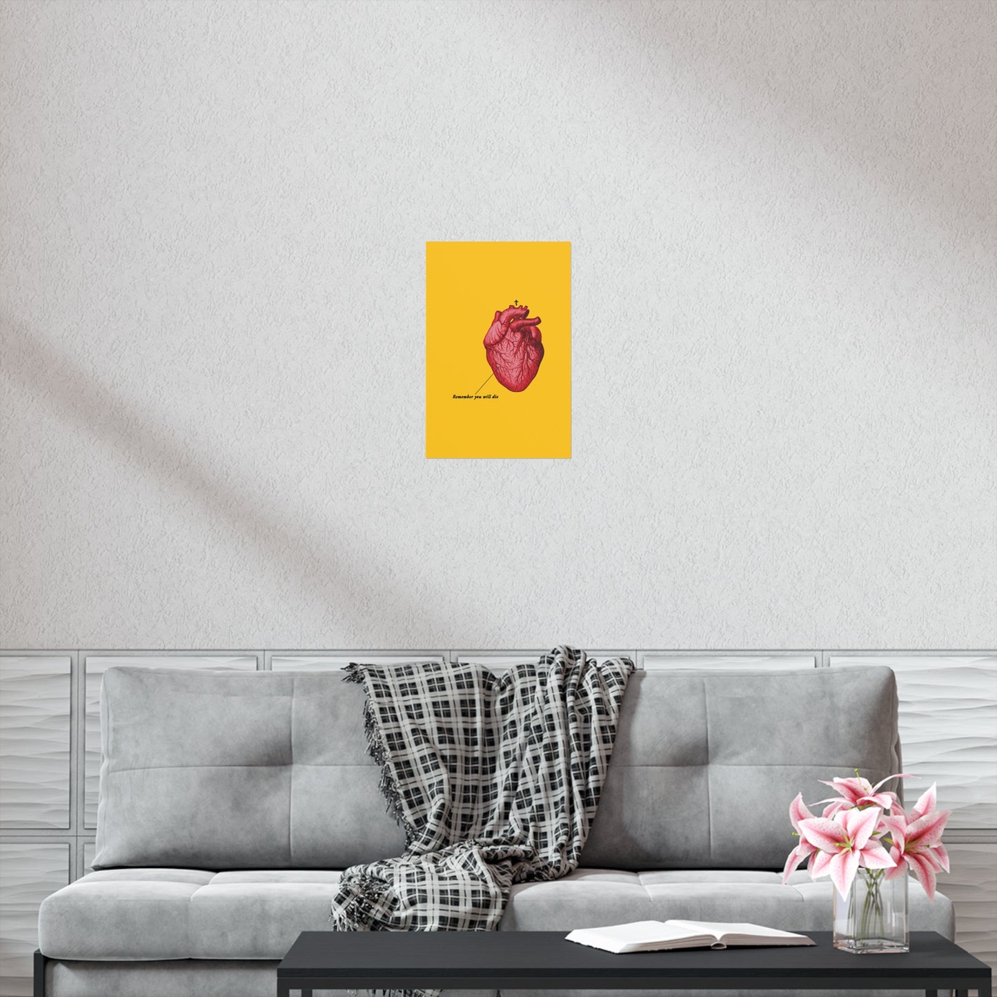 A gray sofa, plaid blanket, coffee table with flowers, and the "Remember You Will Die" Christian art poster with a retro heart and Orthodox cross inspire repentance and quiet reflection, echoing the message, "It's Later Than You Think.