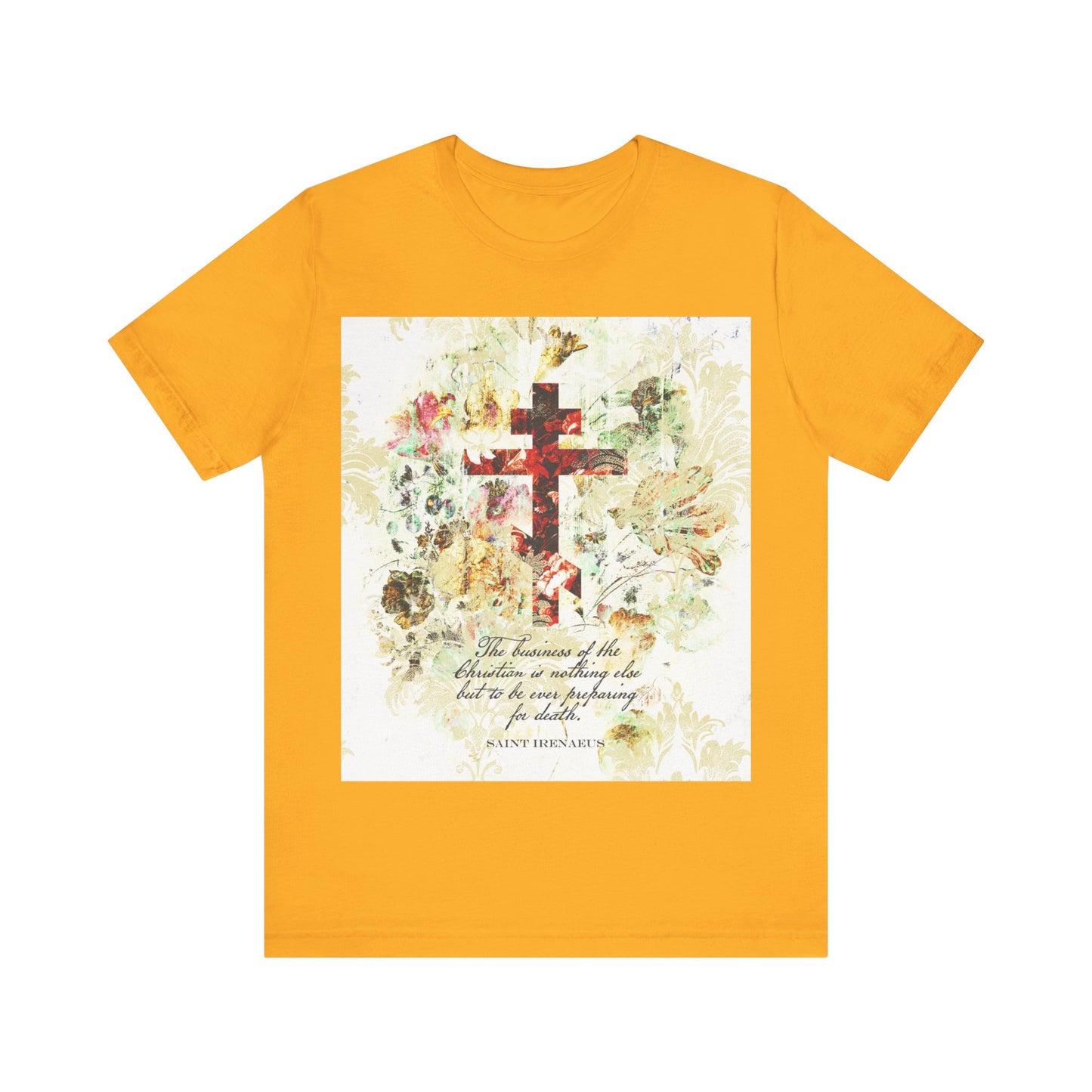 Gold T-shirt featuring a white & beige floral scrapbook-style cross and a quote from St Irenaeus, inspired by Orthodox Christian writings and arts & crafts design.