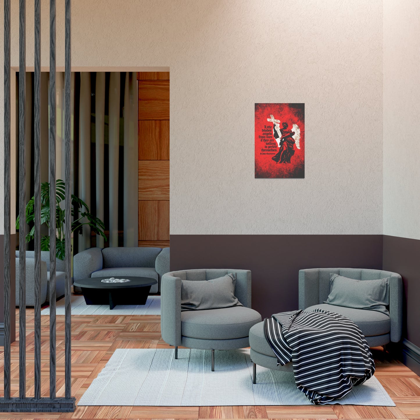 Modern lounge with gray chairs, ottoman, striped blanket, and the "Little Divides Angels from Men" St John Chrysostom Orthodox Christian art poster on the wall—creating a peaceful space for reflection on Jesus.