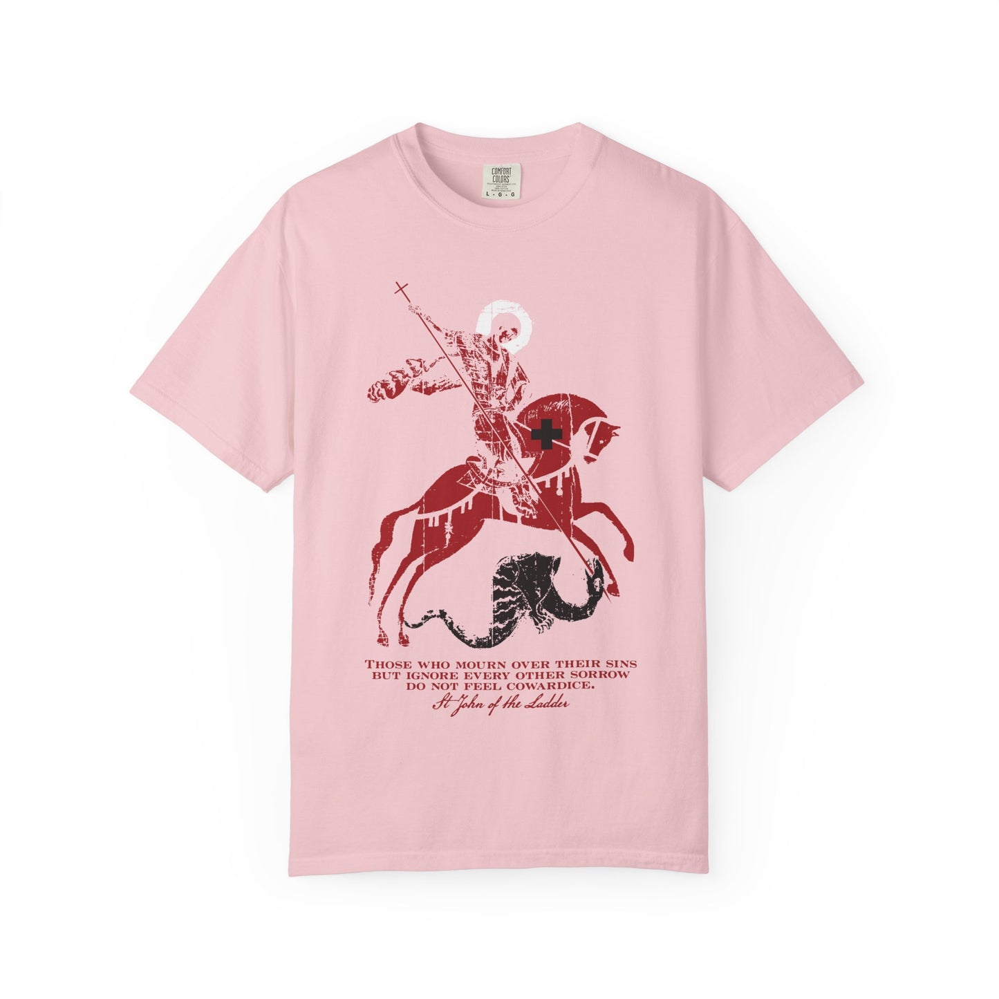 Blossom-colored heavyweight cotton unisex tee featuring a bold red and black graphic of St George slaying the dragon, inspired by St John Climacus, with text beneath the image reflecting Orthodox Christian themes of mourning over one’s sins and godly sorrow.
