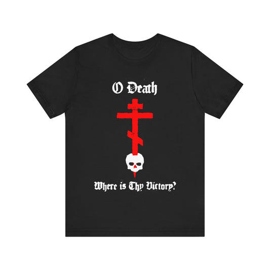 Black cotton t-shirt featuring a spraypaint-style red cross stabbing a white skull, with the text "O Death Where is Thy Victory? 1 Cor 15:55"; an Orthodox Christian design symbolizing victory over death.