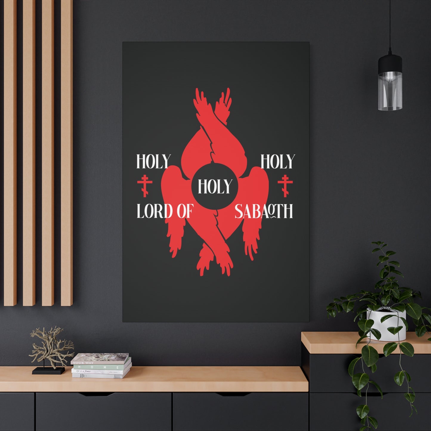 A modern room with a framed "Holy Holy Holy Lord of Sabaoth Red Seraphim Wings Orthodox Crosses" canvas featuring red seraphim, crosses, and Isaiah 6:3 from the Divine Council series.