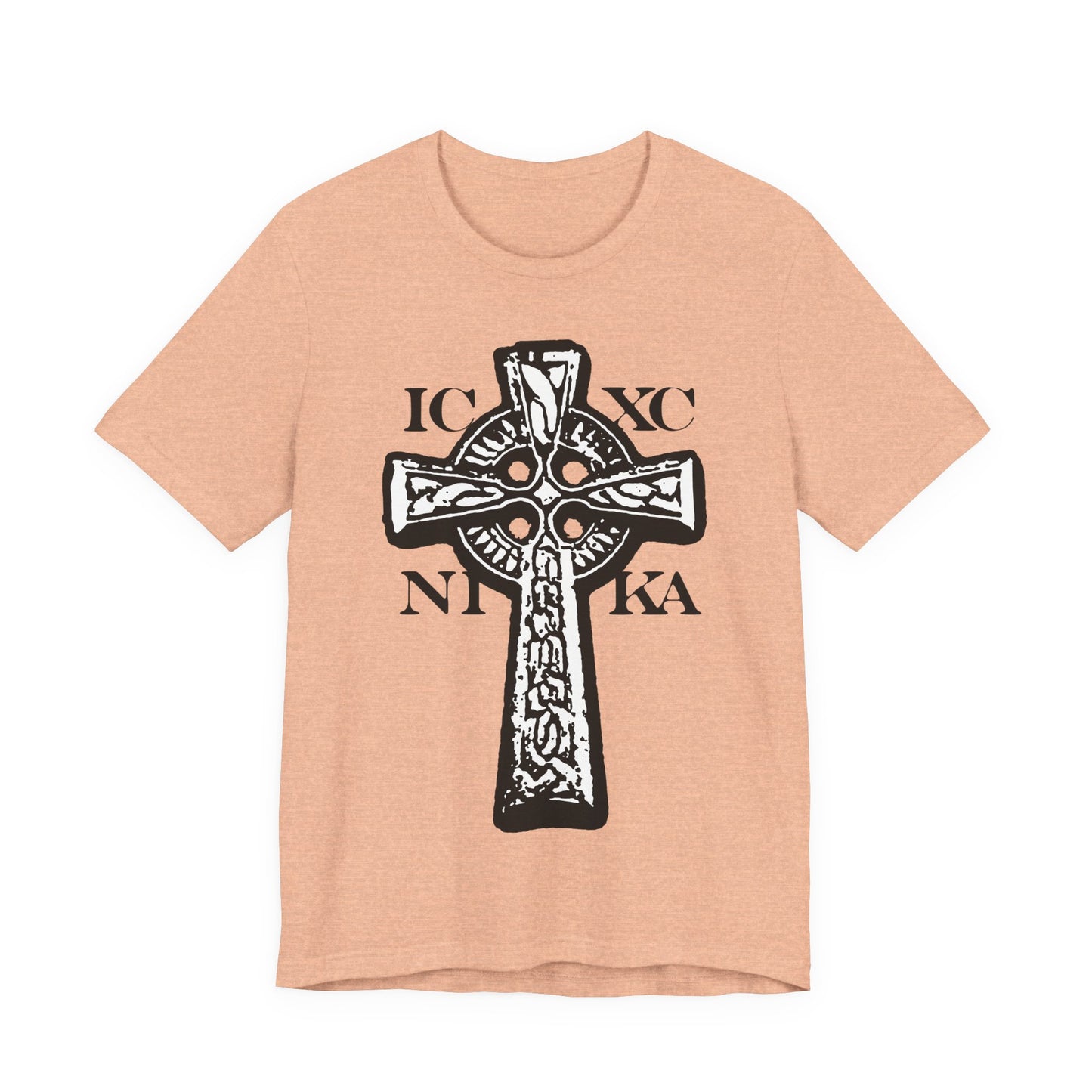 Heather Peach t-shirt featuring the ICXC NIKA Celtic Knotwork Cross in black and white on a red background, with "Jesus Christ Conquers"—a traditional Orthodox Christian design symbolizing salvation.