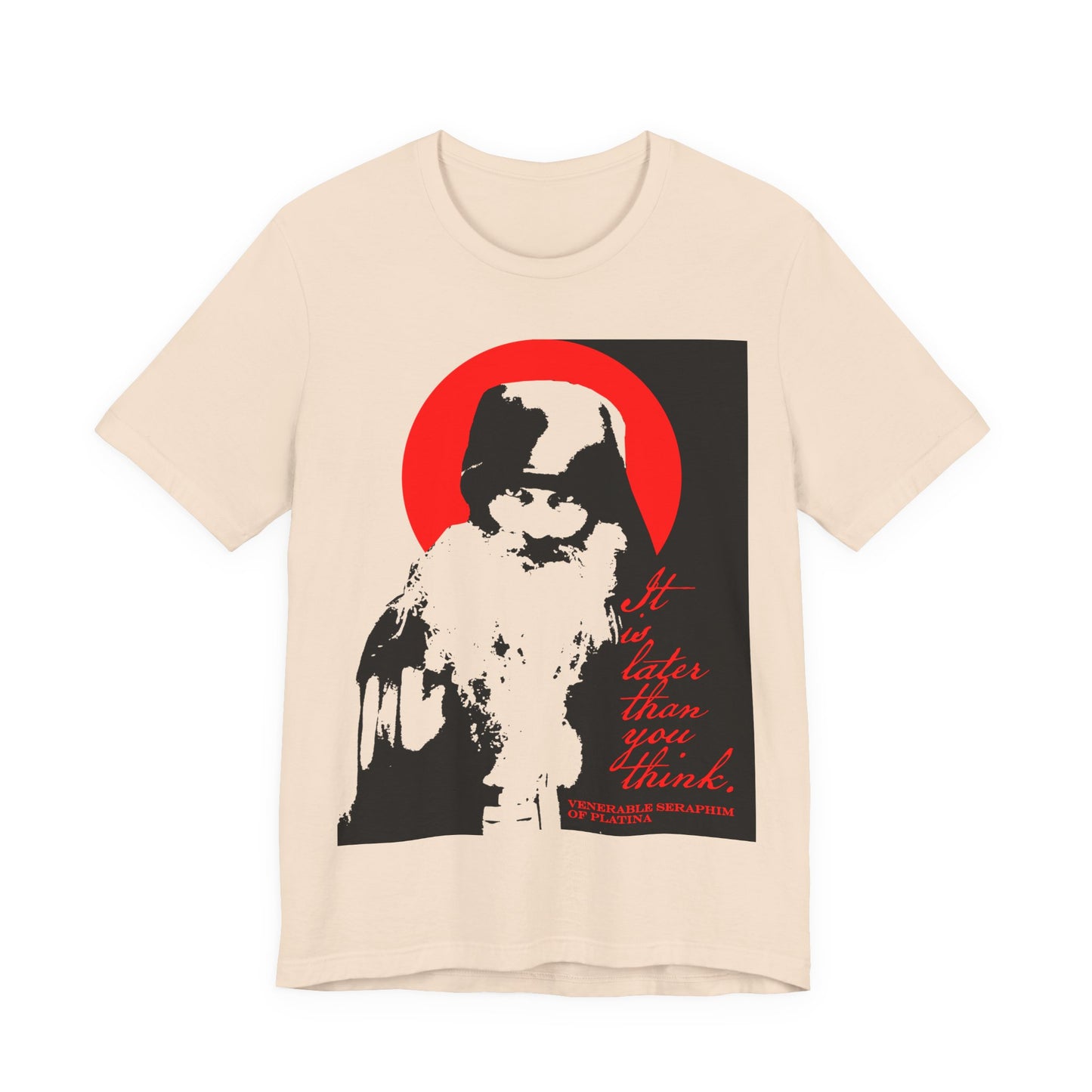 Soft Cream t-shirt featuring a bold black, white, and red graphic of Fr Seraphim Rose with the text "It's Later Than You Think"—a modern Orthodox memento mori calling to spiritual discipline.