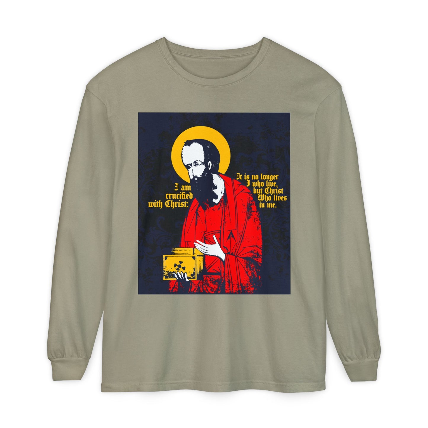 The St Paul Holding Gospel Iconographic long sleeve shirt in sandstone features “I am crucified with Christ” (Galatians 2:20), reflecting new life and deep faith in the Son of God. Orthodox Christian-inspired.