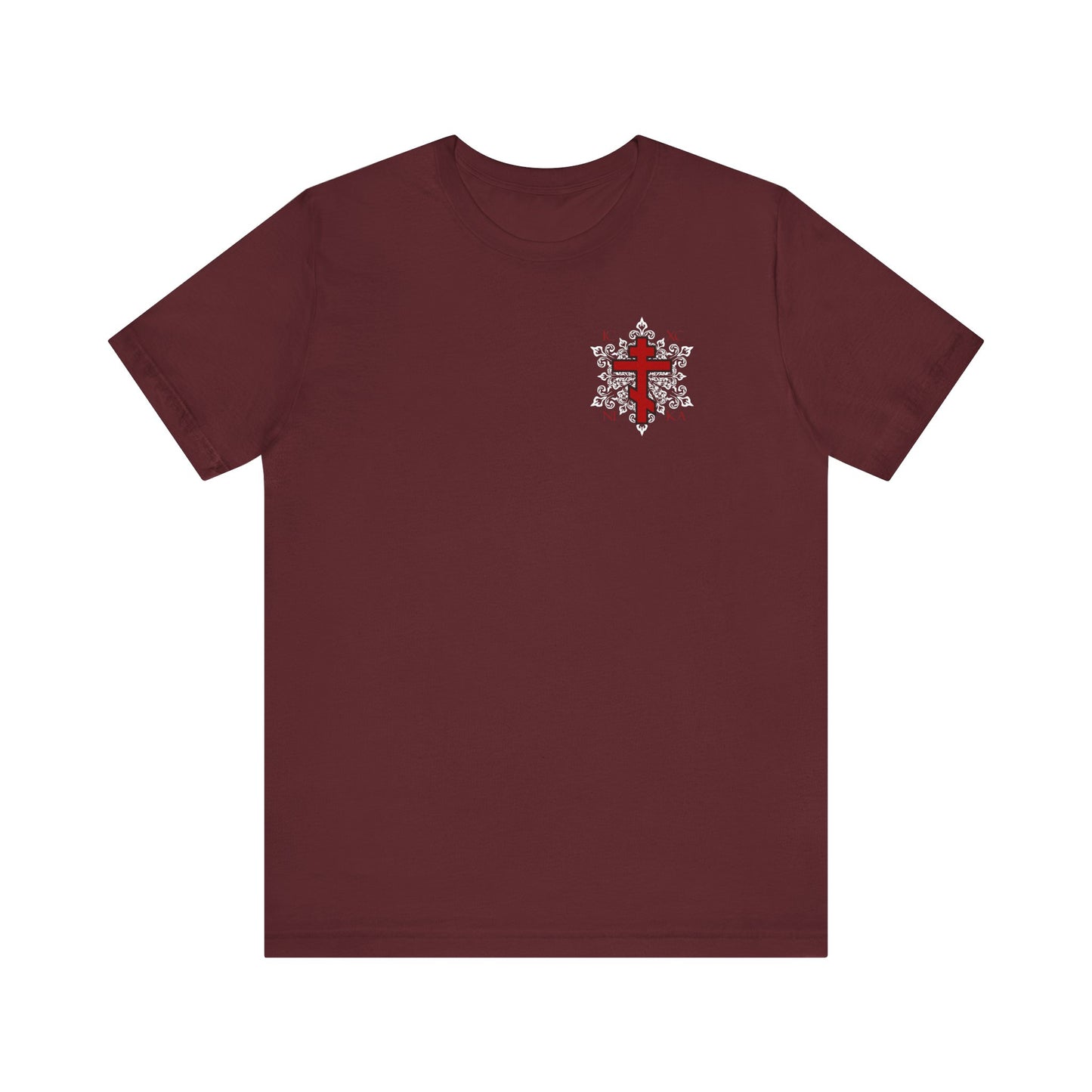 Maroon ICXC / NIKA tee with a red Orthodox cross and ornate white medieval floral design on the left chest, inspired by Paradise and St. Romanos. Lightweight best-selling unisex cotton shirt.