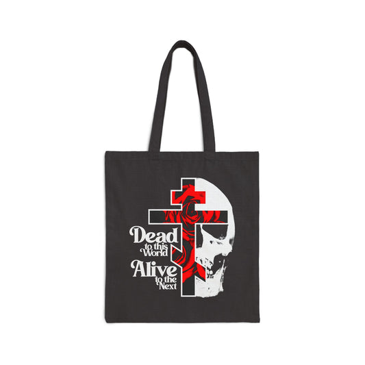 Carry your essentials in this bestselling black cotton tote bag, featuring a Christian goth flower cross, skull, and 70s typography: “Dead to this World.” A bold symbol of spiritual transformation.