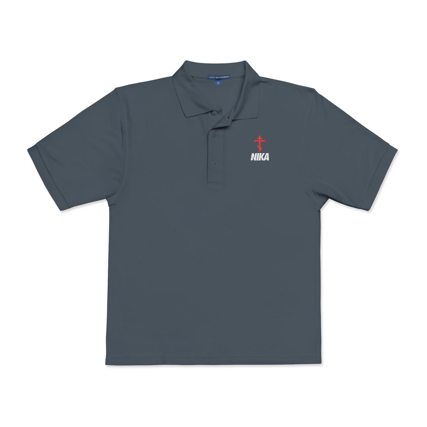 Steel grey polo shirt featuring a red Orthodox cross and white "NIKA" text on the left chest, inspired by the NIKE logo. Embroidered design reflects Christian faith: Jesus Christ Conquers—athletic ascetic fashion.