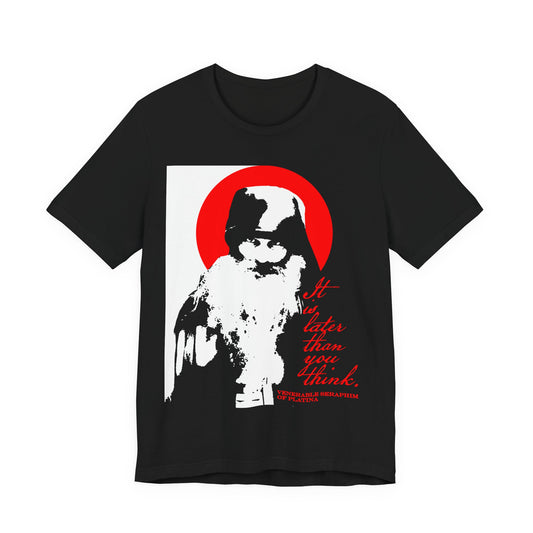 Black "It's Later Than You Think" t-shirt featuring Fr Seraphim Rose, inspired by Orthodox memento mori, with a striking red circle and text. High-contrast black, white, and red design, perfect for spiritual reflection.