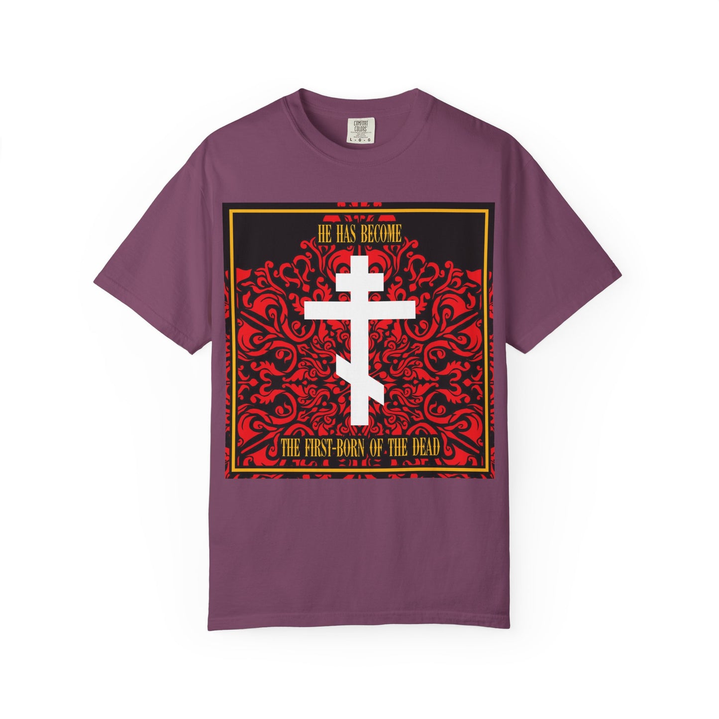 Berry unisex heavyweight cotton tee featuring a white Orthodox cross on a red floral texture, and text: He Has Become the First-Born of the Dead—a striking Christian t-shirt inspired by a powerful Bible verse.
