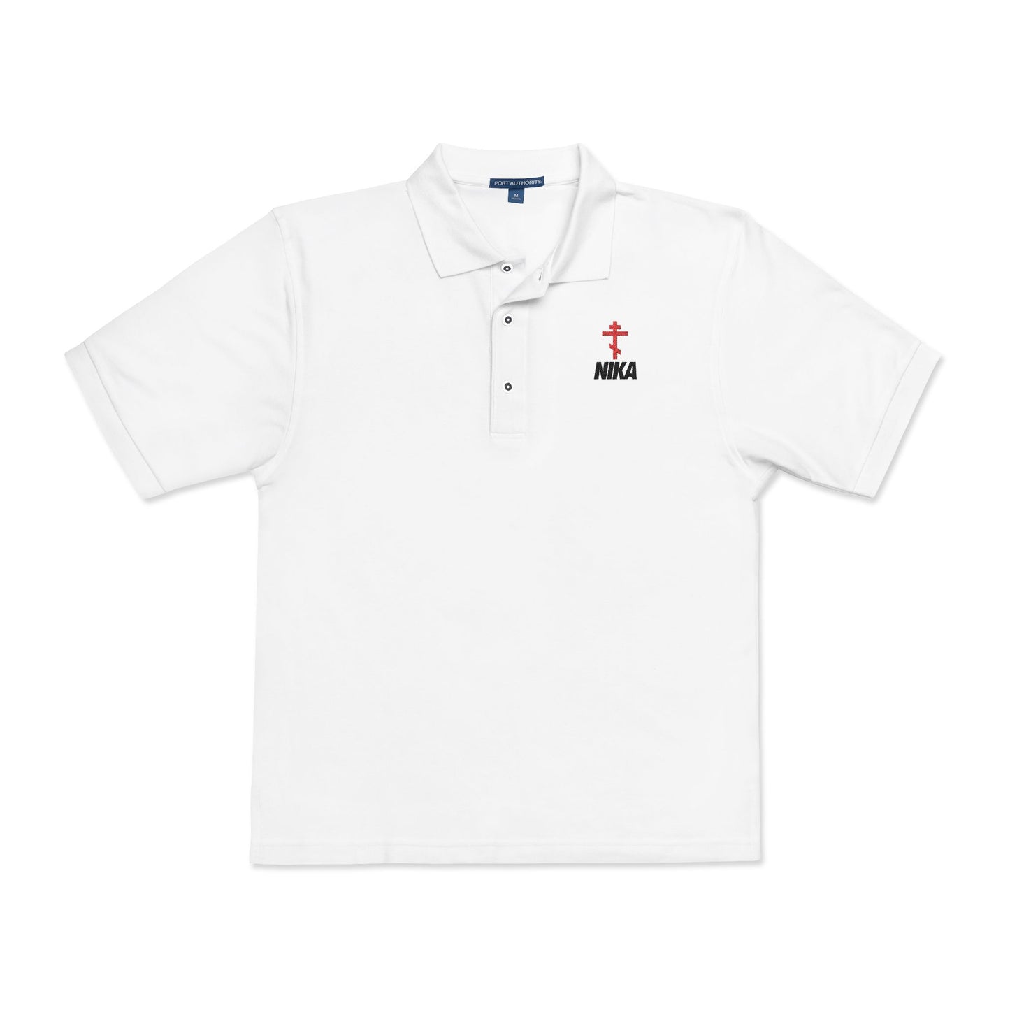 White polo shirt with an embroidered red Orthodox cross, black "NIKA" text on the left chest, inspired by the NIKE logo—symbolizing victory in Christ, as referenced in Revelation 3:21.