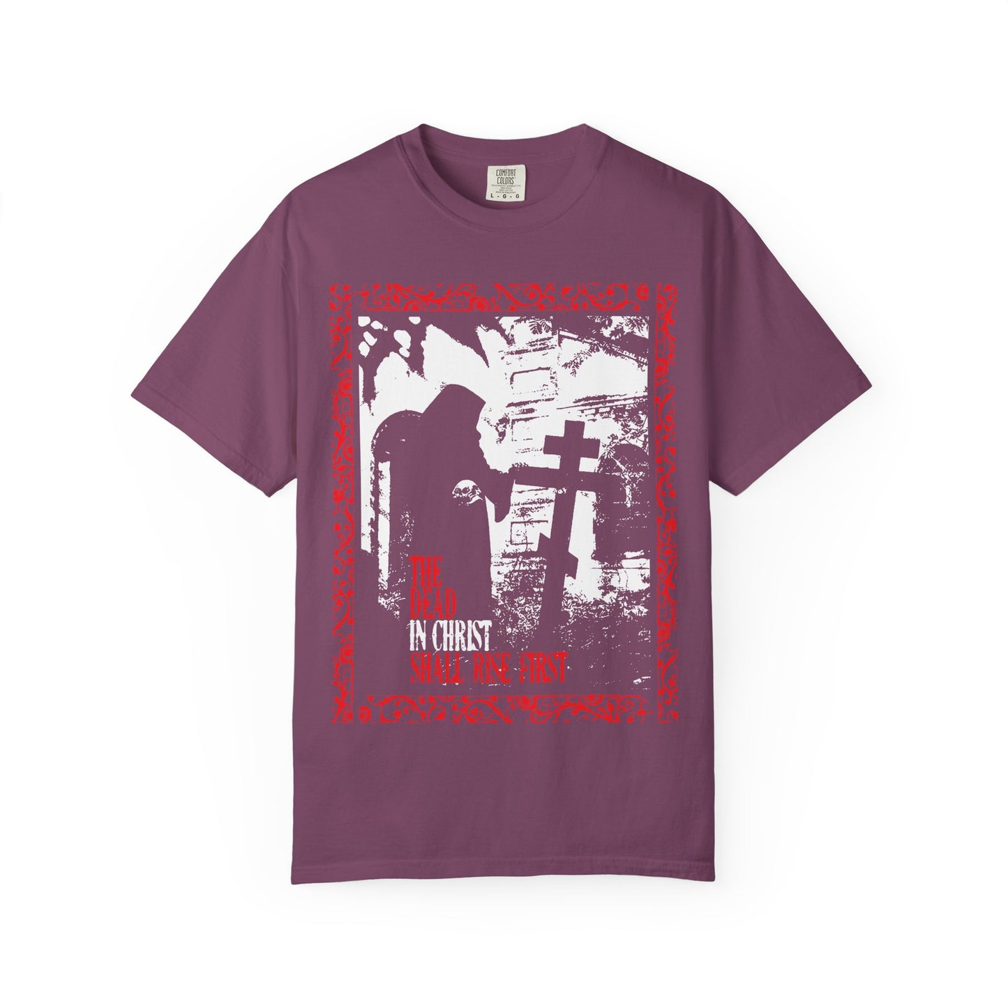 Berry "The Dead in Christ Shall Rise First" heavyweight cotton unisex tee featuring a gothic graveyard design with a hooded figure by a cross and the text “IN CHRIST SUFFER THY FIRST,” inspired by 1 Thessalonians 4:16—symbolizing soul liberation and the promise of blessings after death; Orthodox Christian style.
