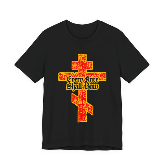 Black unisex tee featuring a gold and red floral Orthodox cross with gothic lettering and "Every Knee Shall Bow," inspired by Isaiah 45:22-24 and Philippians 2:7-11.