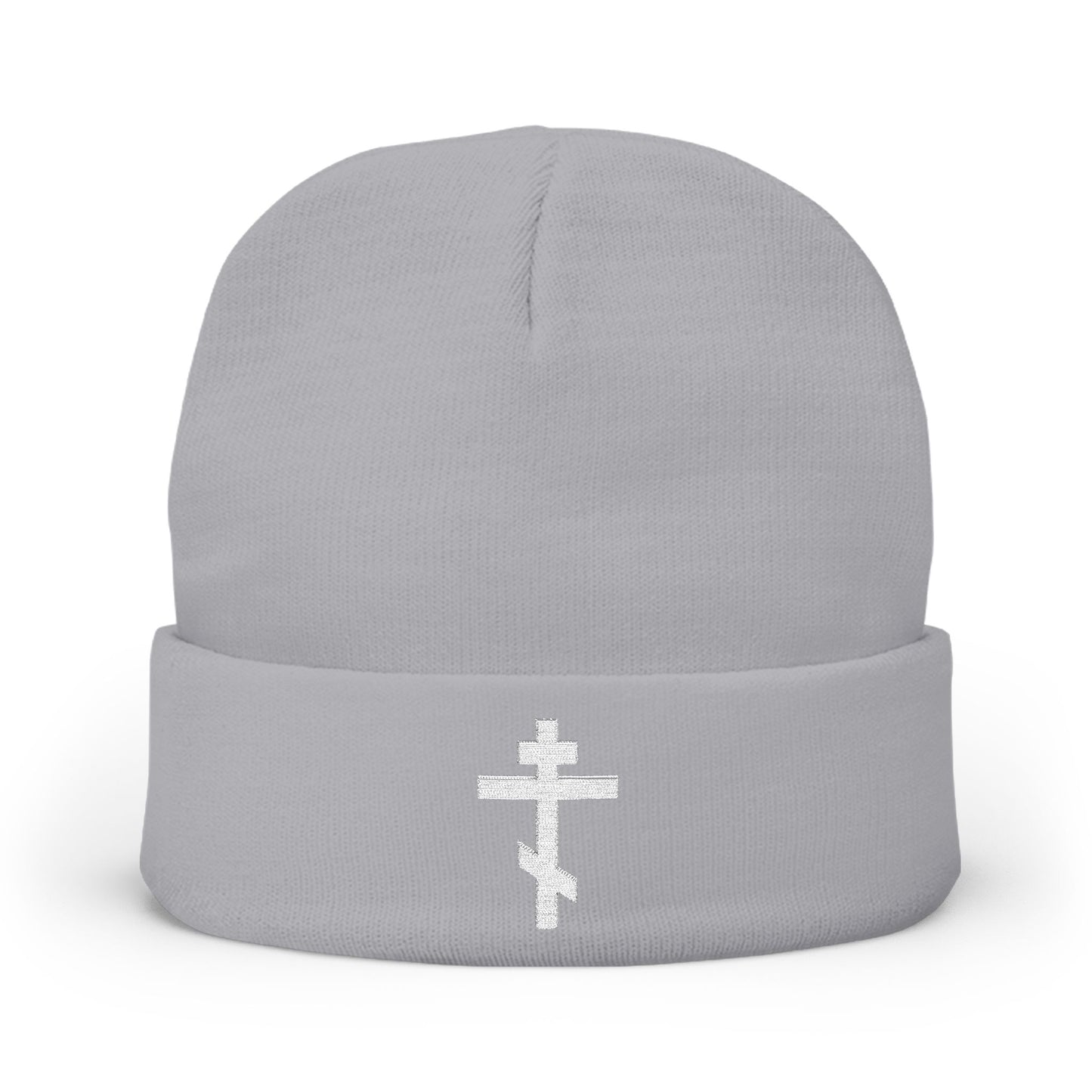 Gray knit beanie featuring a white Orthodox TriBar cross embroidered on the front, inspired by the prayer “Nail My Passions to the Wood of Thy Precious Cross O Lord.”.