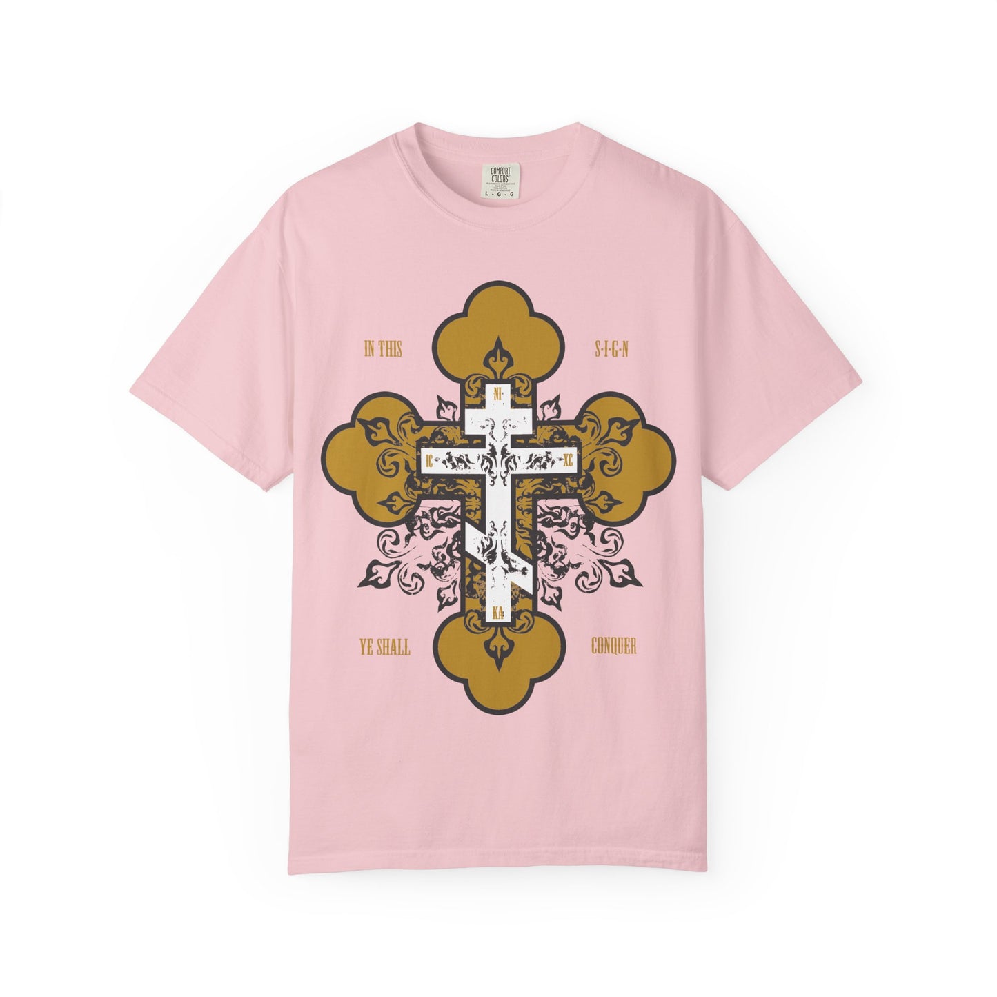 Blossom-colored unisex heavyweight cotton tee featuring a gold and white Orthodox ornate cross and the text "In This Sign Ye Shall Conquer" (In Hoc Signo Vinces)—an inspirational Christian shirt inspired by St. Joseph the Hesychast.