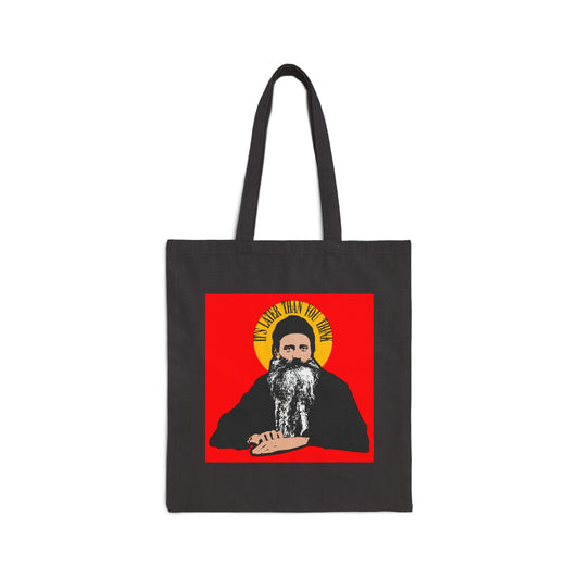 Black tote bag featuring modern artwork of Fr Seraphim Rose with a yellow halo and "It's Later Than You Think" quote, reflecting Orthodox Christian themes. Product name: It's Later Than You Think Tote Bag. Color: Black.