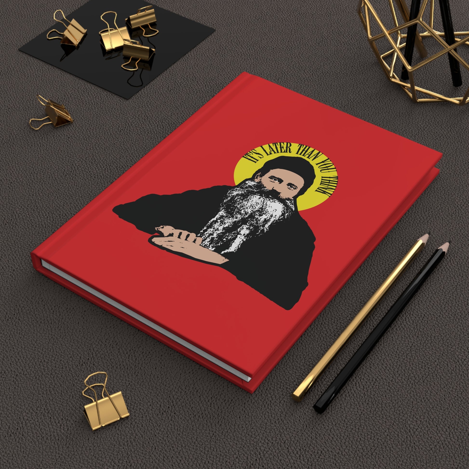 Red notebook with Fr Seraphim Rose quote “IT’S LATER THAN YOU THINK” in a yellow halo—modern Orthodox Christian design inspired by American saints. Orthodox Christian Notebook.