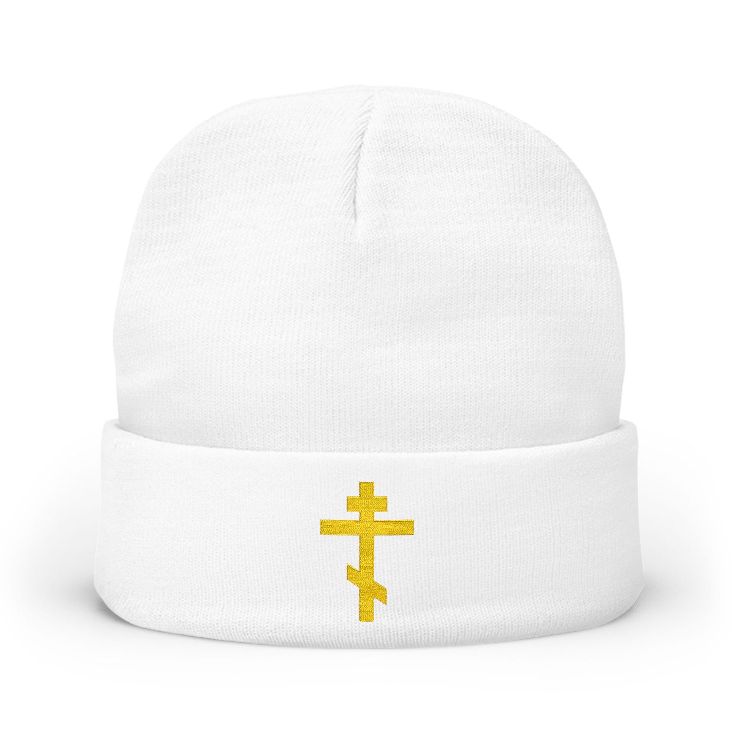 White knit beanie featuring a yellow Orthodox TriBar cross and "Nail My Passions to the Wood of Thy Precious Cross O Lord" embroidery, symbolizing Christ and salvation.