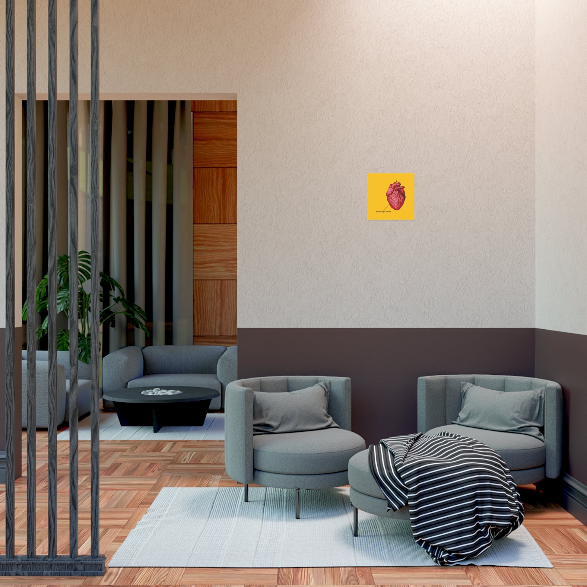 Modern lounge area with gray chairs, striped blanket, and a "Remember You Will Die" Retro Medical Textbook Heart Design Christian Art Poster—inviting reflection on repentance and renewal.