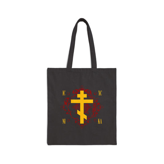 Black tote bag with a yellow Russian Orthodox Cross and gold Cyrillic “ICXC NIKA” on an ornate red background, inspired by the grace of sonship. “Jesus Christ Conquers” Orthodox Christian design.