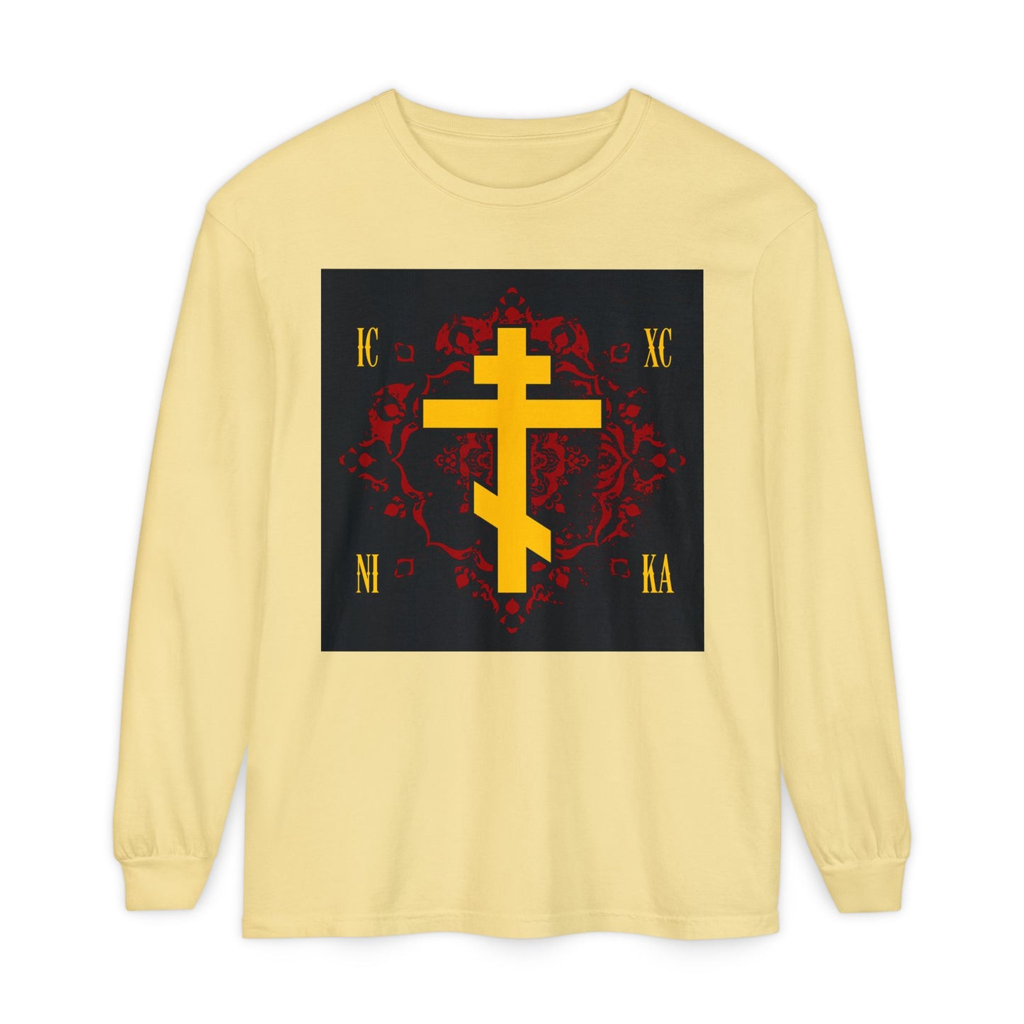 Butter-colored long-sleeve shirt featuring a gold Russian Cross and "ICXC NIKA" on an ornate red background. Orthodox Christian design celebrates Jesus Christ Conquers.