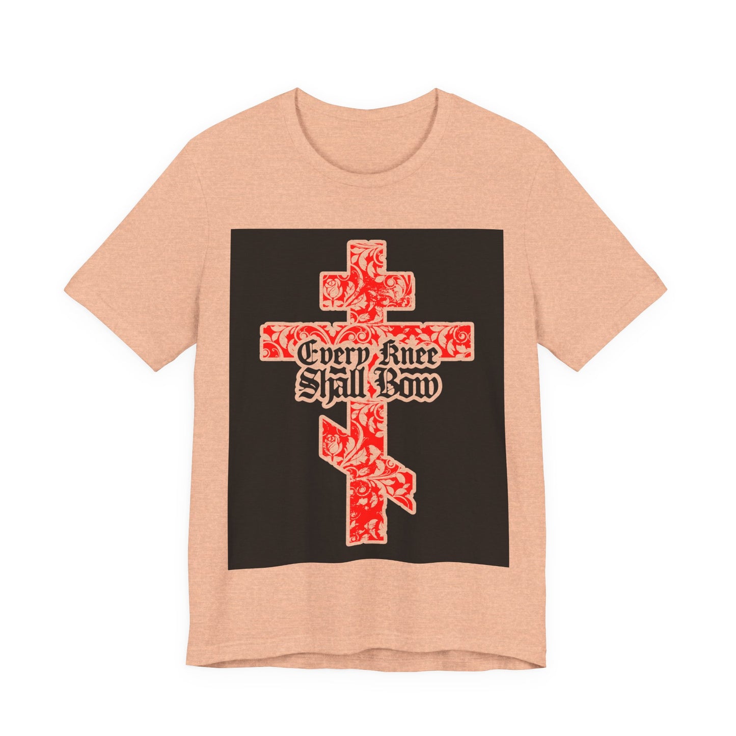 Peach unisex tee featuring a gold and red floral Orthodox cross with gothic "Every Knee Shall Bow" text (Isaiah 45:22-24, Phil 2:7-11), honoring Jesus Christ.