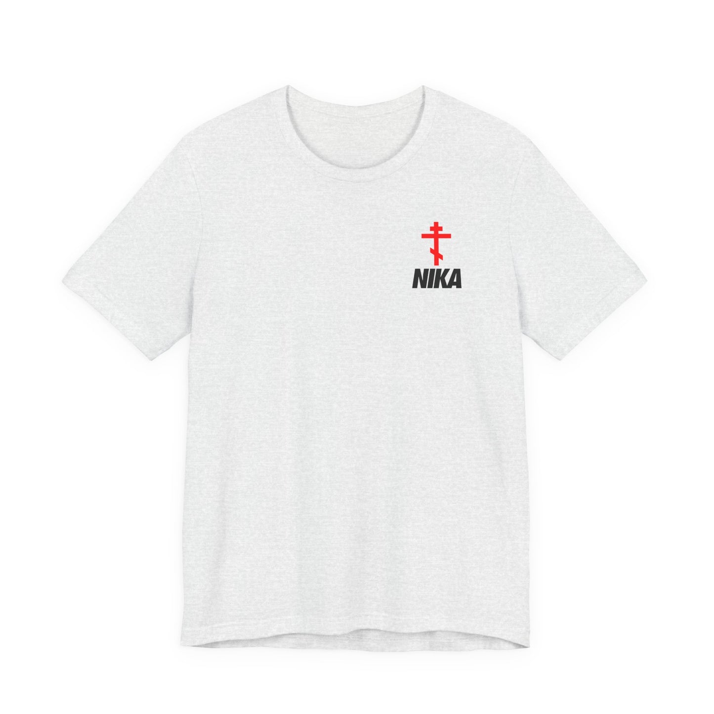 Ash-colored t-shirt featuring an Orthodox cross with bold NIKA text, inspired by the NIKE logo and the phrase "Jesus Christ Conquers," in a small design on the left chest.