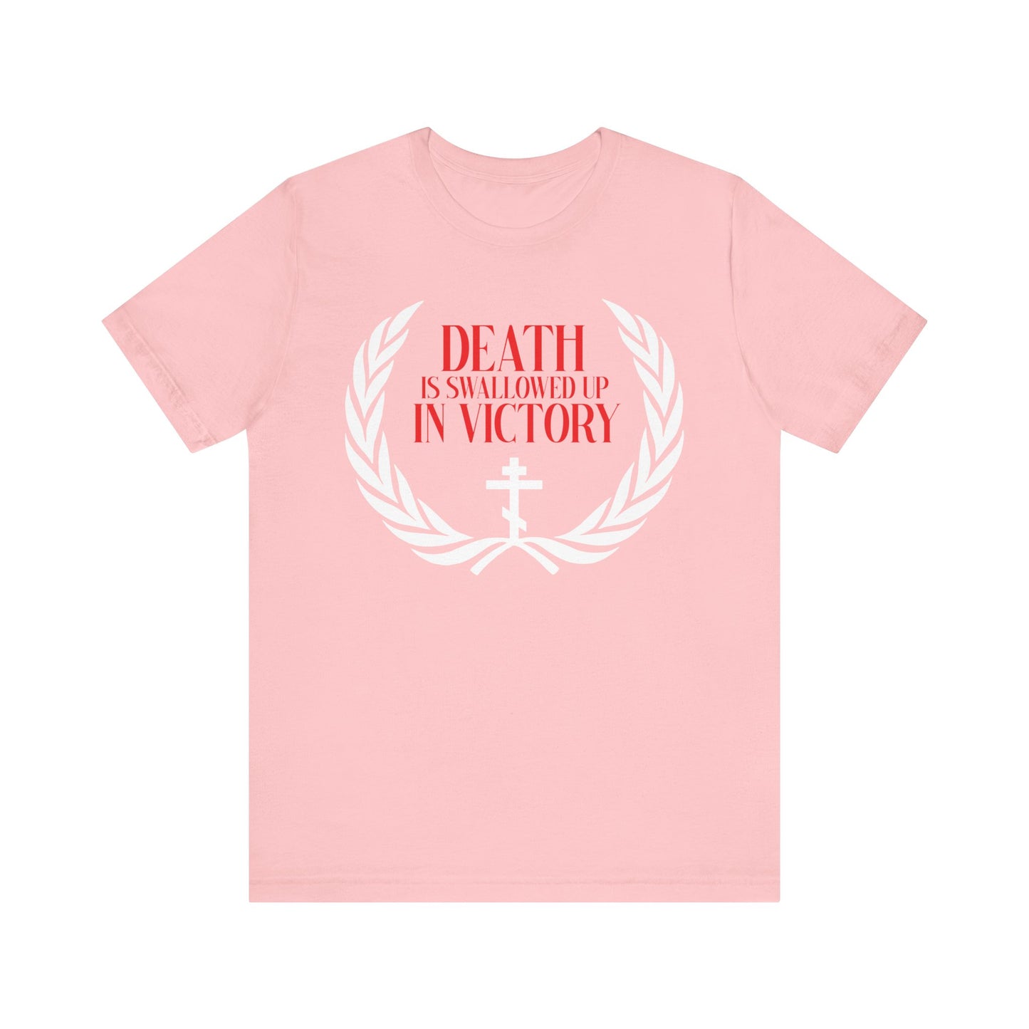 Celebrate victory over death in this pink lightweight cotton t-shirt featuring a white laurel, Orthodox cross, and red "DEATH IS SWALLOWED UP IN VICTORY" text (1 Cor 15:54).