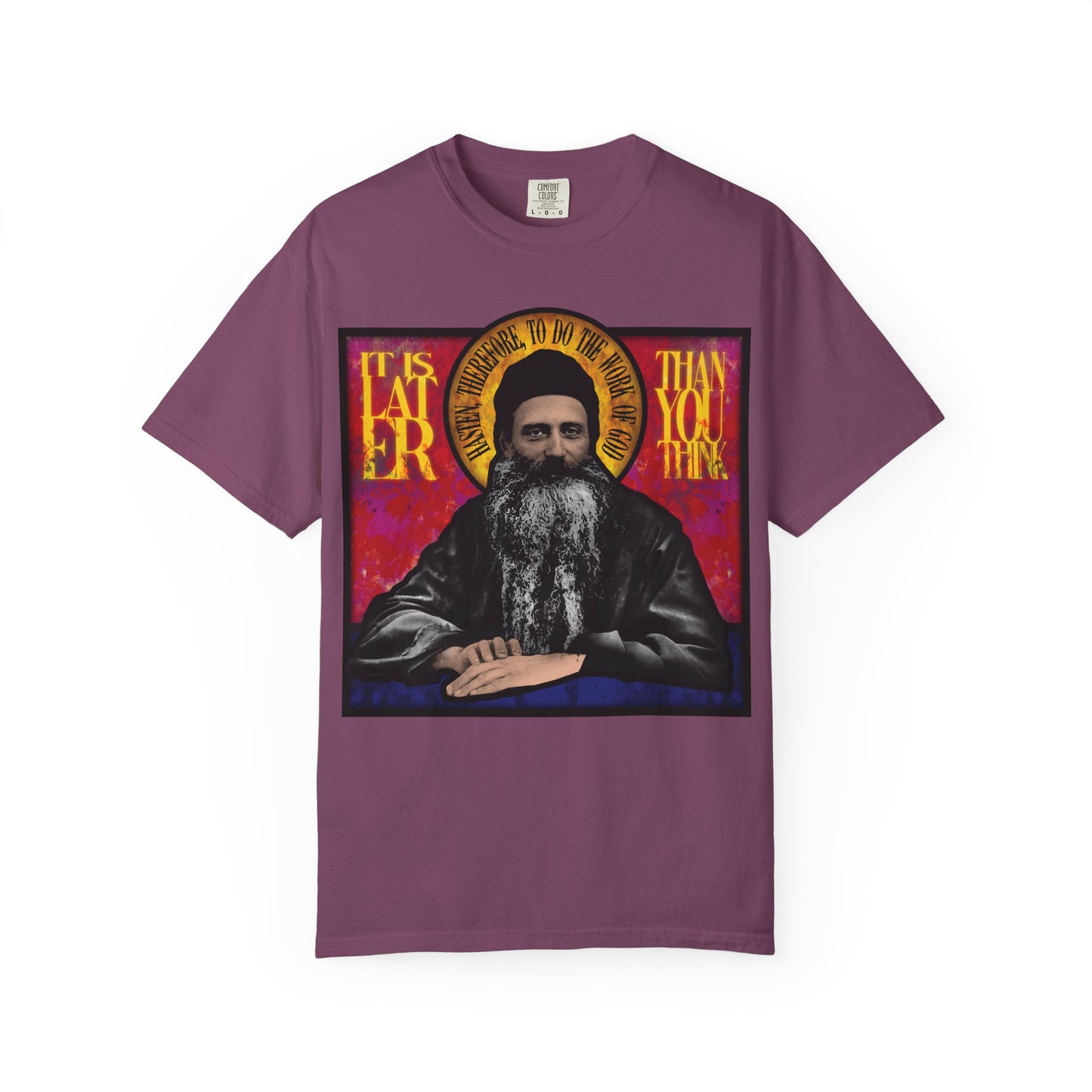 Purple heavyweight cotton unisex t-shirt with a stained glass design of Fr. Seraphim Rose and the bold yellow text “It is later than you think”—a striking nod to this American Orthodox monastic saint.