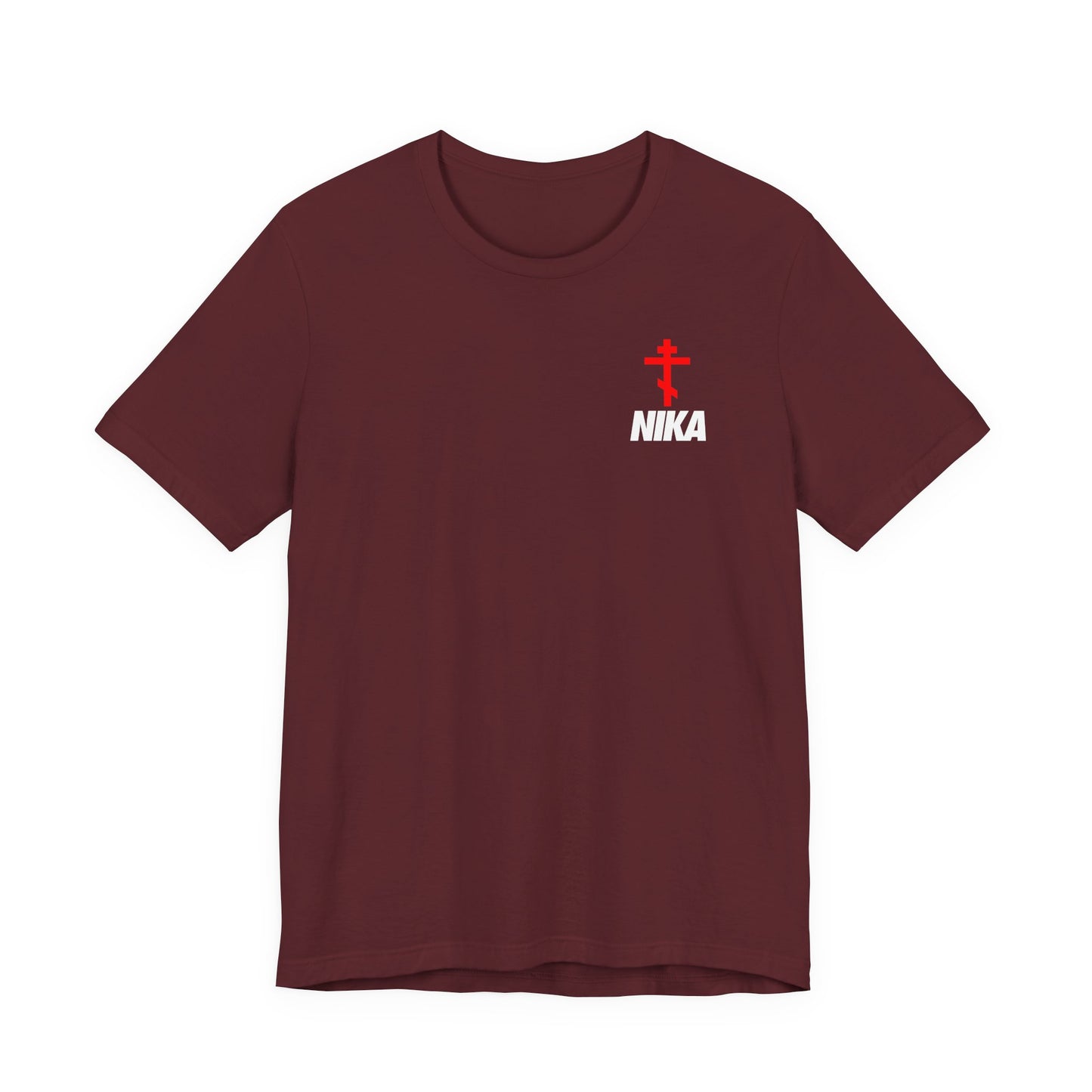 Maroon t-shirt with an Orthodox Cross and bold NIKA text in a small design, inspired by the NIKE logo. Features "Jesus Christ Conquers" theme—athletic ascetic Christian fashion.