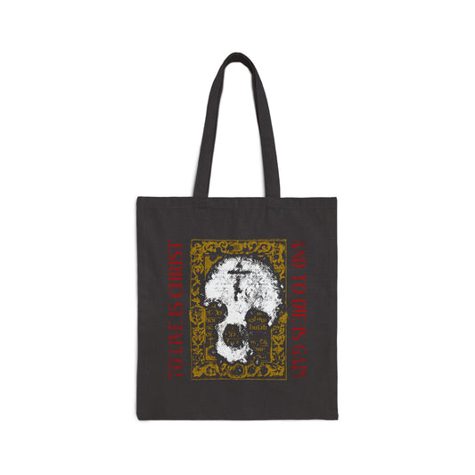 Black tote bag featuring a skull with cross on a gold manuscript background and red "TO LIVE IS CHRIST AND TO DIE IS GAIN" text—a unique Orthodox Christian design inspired by Philippians 1:21.