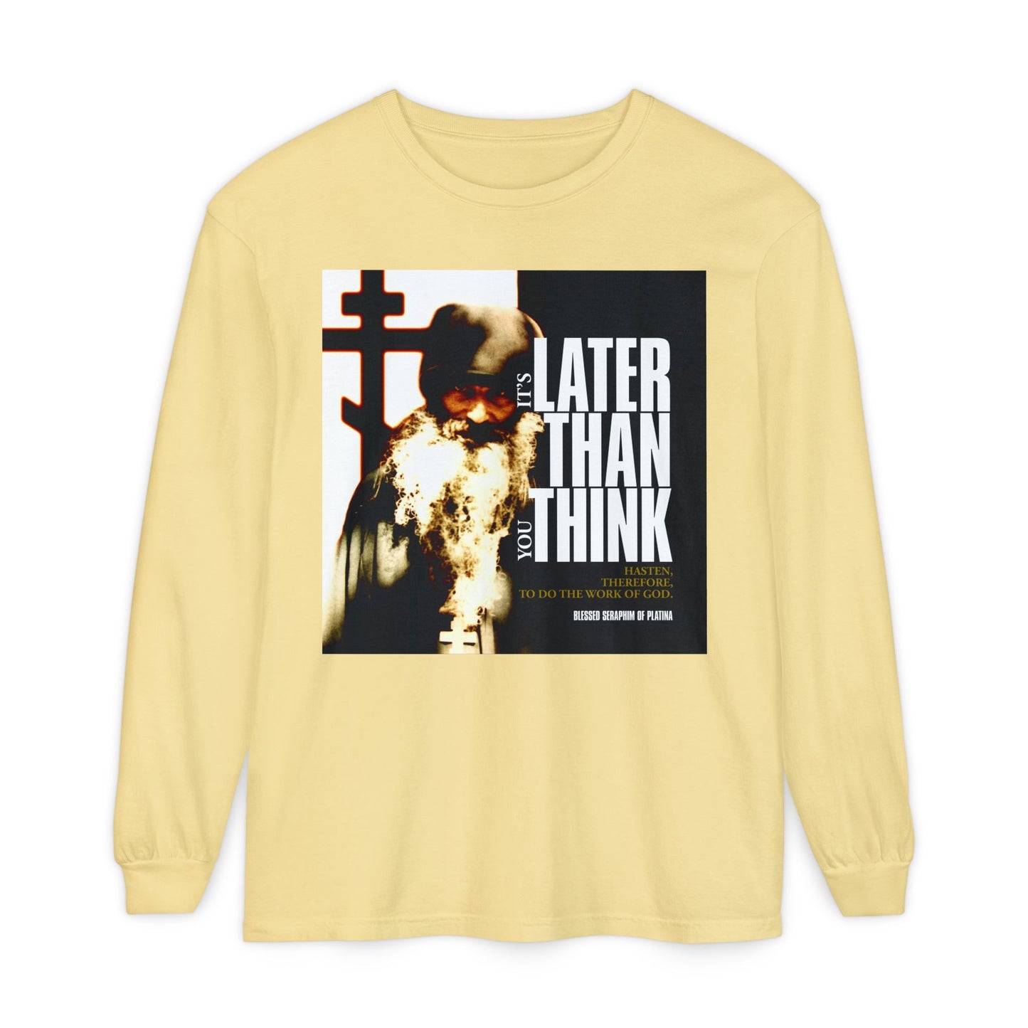 The butter-colored long sleeve shirt features Fr. Seraphim Rose, a cross, and bold modern typography: "It's Later Than You Think"—an Orthodox Christian reminder inspired by Blessed Seraphim of Platina.