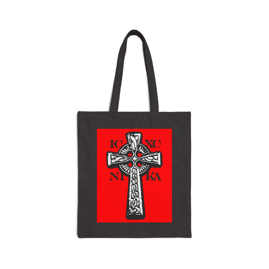 Black tote bag featuring the ICXC NIKA Celtic Knotwork Cross in black and white on a red background, symbolizing "Jesus Christ Conquers" in traditional Orthodox Christian style.