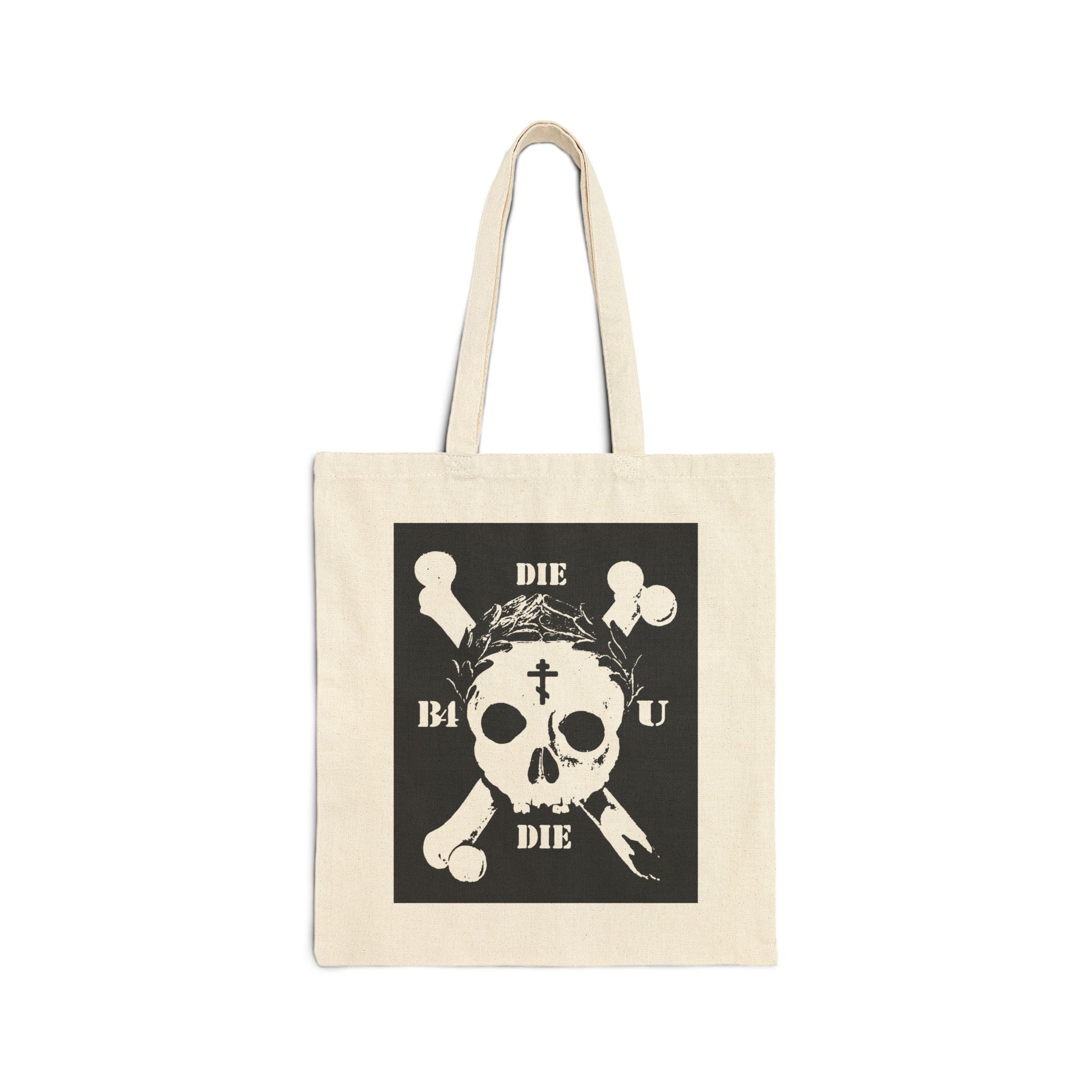 Natural tote bag featuring a retro skull & crossbones, Orthodox cross, laurel victory wreath, and "Die Before You Die"—a striking memento mori inspired by ascetic Christian teachings and Matthew 16:24-25.