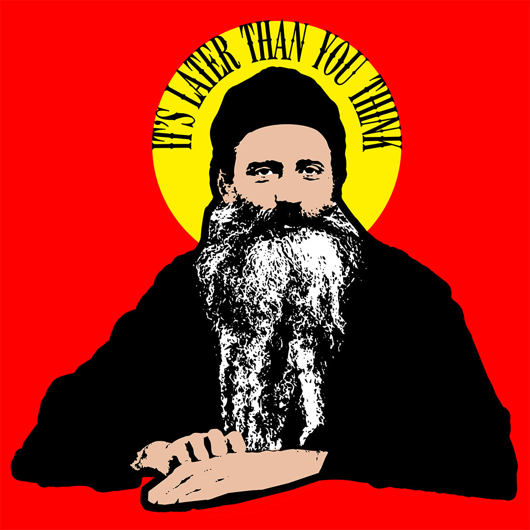 Featuring a stylized bearded man with a yellow halo and the quote "It's Later Than You Think," this Orthodox Christian hoodie honors Fr Seraphim Rose, blending modern design with faith on a striking red and yellow background.