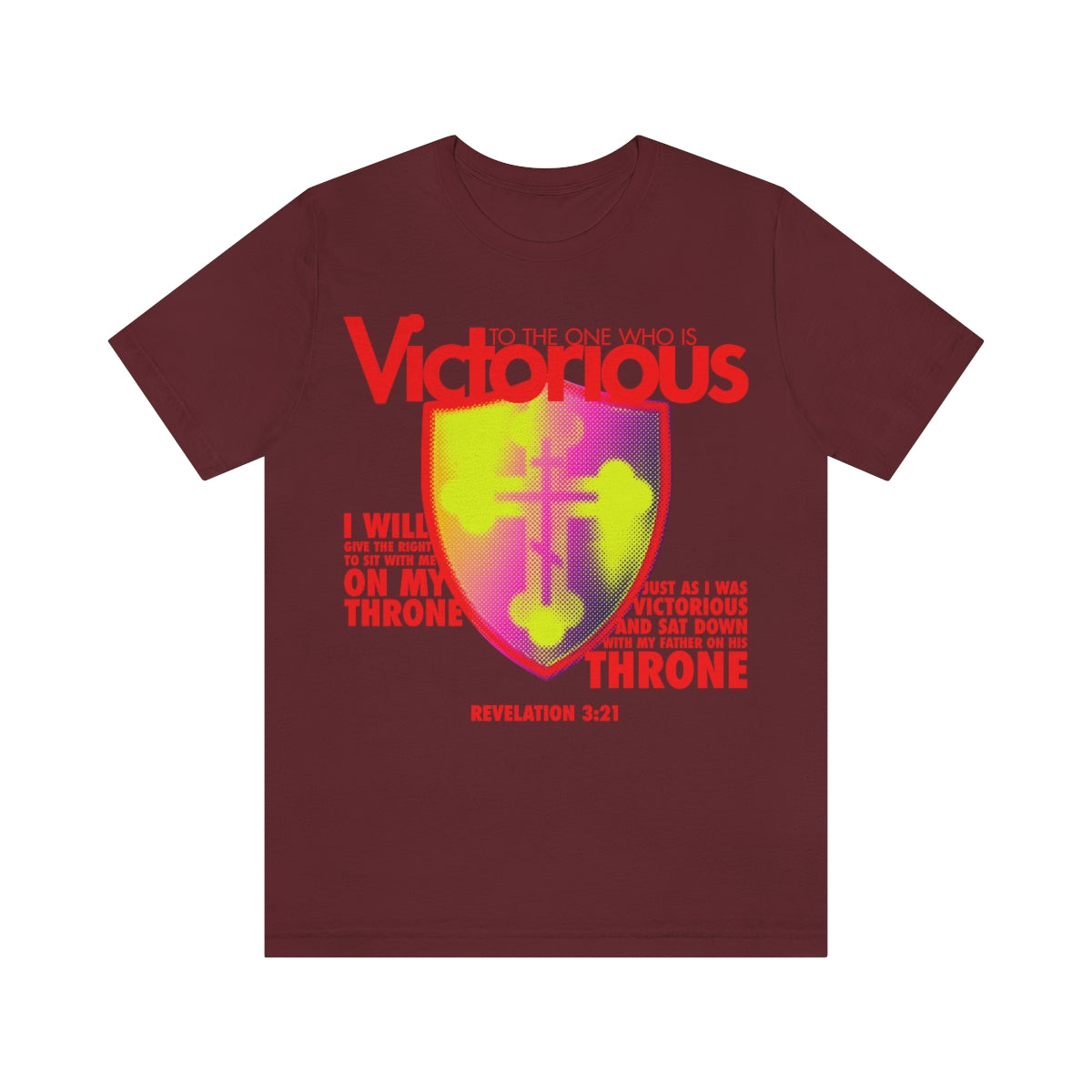 Maroon t-shirt featuring a bright yellow and magenta Russian cross shield design, modern font, and the text To The One Who Is Victorious with scripture reference Revelation 3:12.