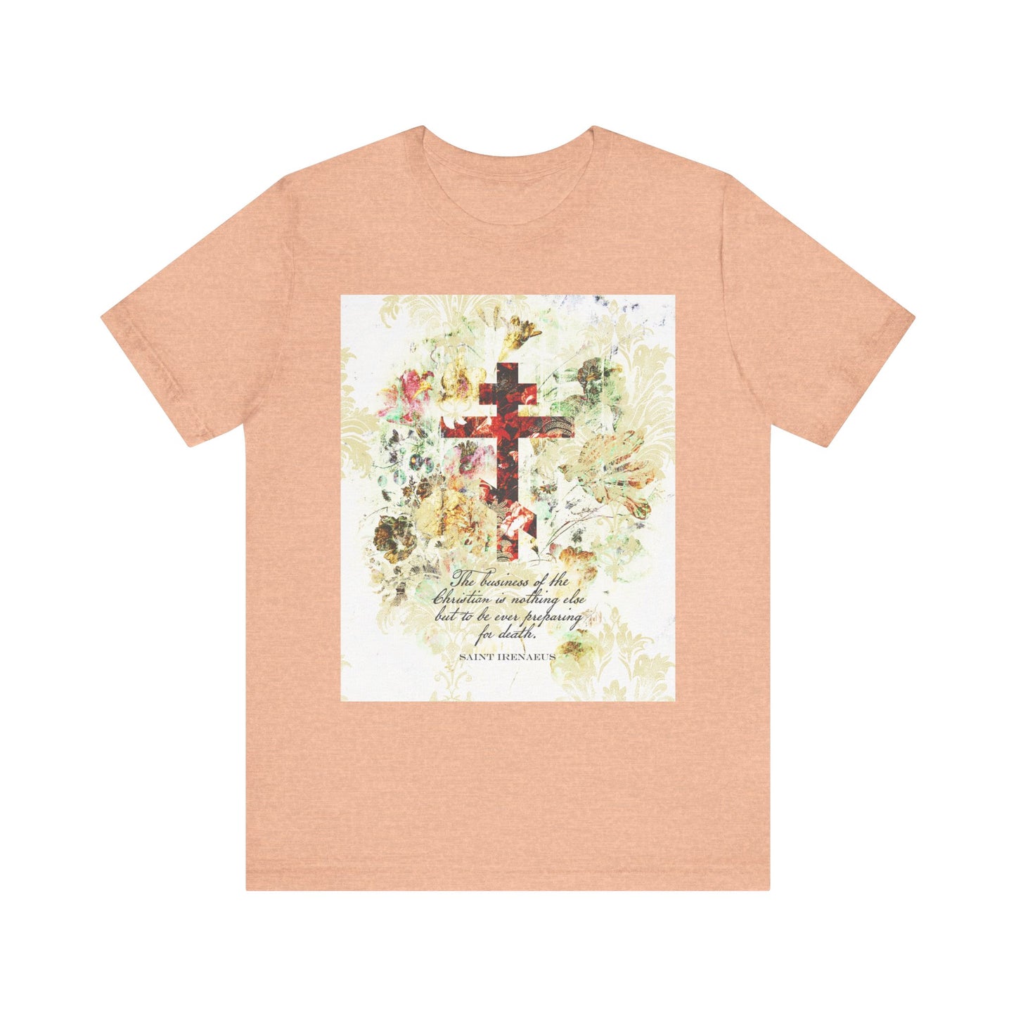 Heather Peach lightweight cotton unisex tee featuring a white and beige floral scrapbook texture cross in arts & crafts style and an inspirational quote from St. Irenaeus, perfect for those reflecting on Christian death preparation and the wisdom of saints.