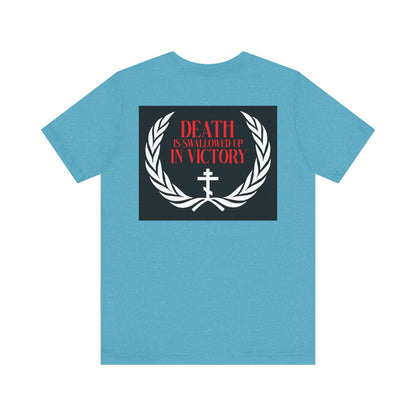 The Archangel Michael of the Apocalypse Iconographic T-shirt features a laurel wreath and cross with "Death is Swallowed Up In Victory," inspired by Revelation 12:7-9. Double-sided design on lightweight cotton. Unisex fit.