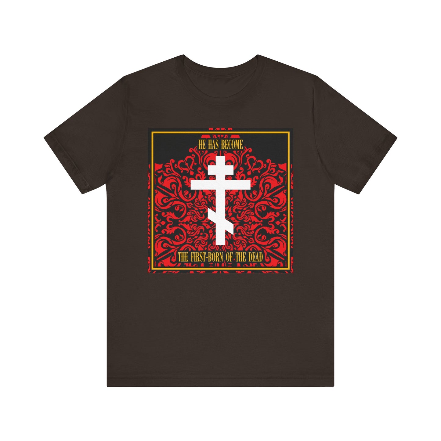 Brown lightweight cotton unisex tee featuring a white Orthodox cross over a red floral texture and yellow “He Has Become the First-Born of the Dead” text, honoring Jesus Christ as our faithful witness.