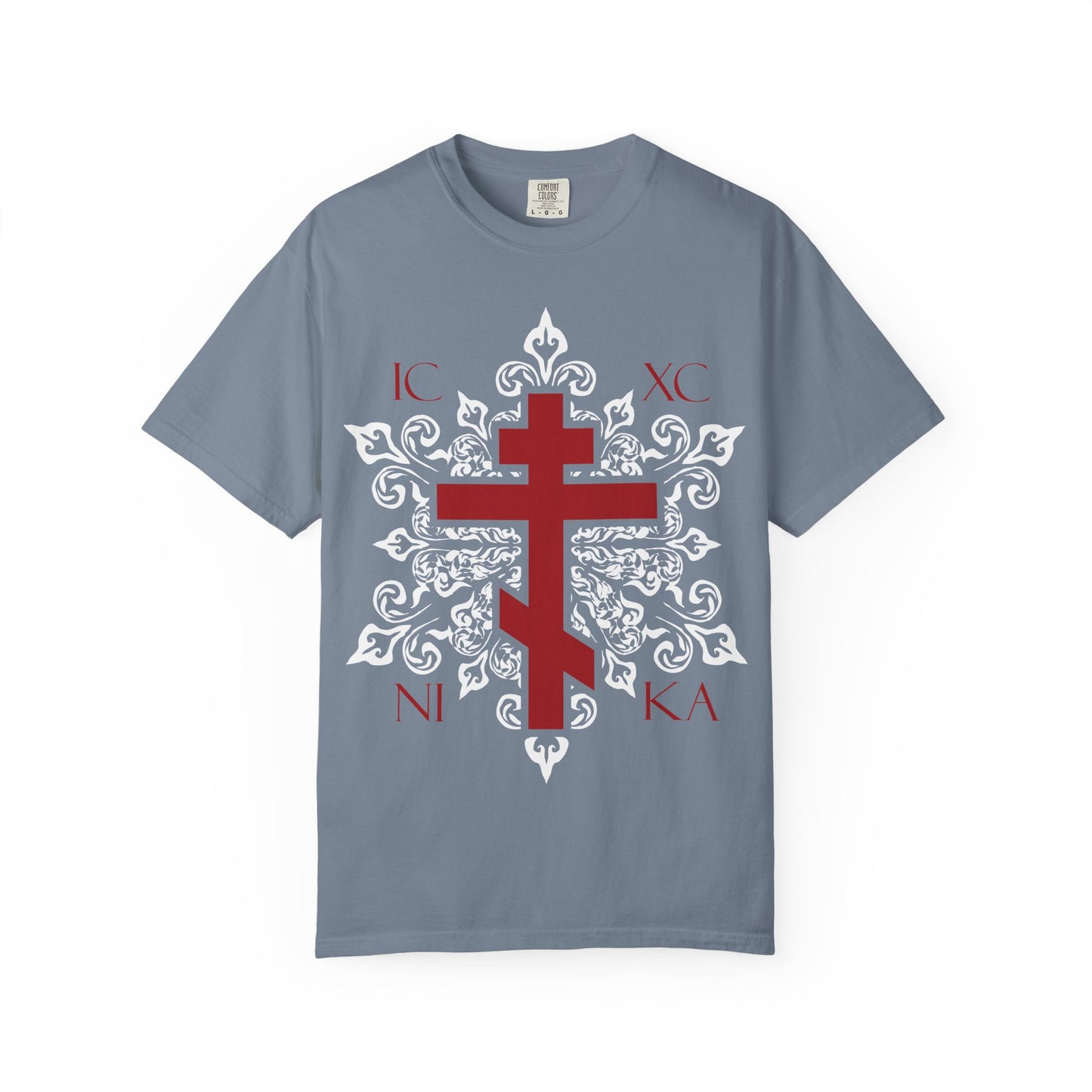 Blue Jean T-shirt featuring a striking red Orthodox cross over an ornate white medieval floral design, with the red letters IC XC NI KA on the front—our best-selling Orthodox Christian heavyweight cotton unisex tee. This inspiring shirt pays tribute to Adoration at the Cross, capturing the reverent spirit of Paradise and echoing timeless hymns from St. Romanos’ Kontakia.