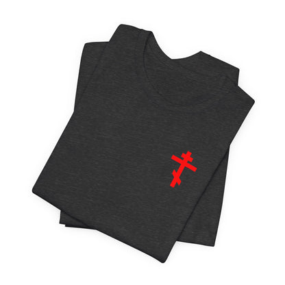 A folded dark grey heather "Idoloclast Idol Smasher Hammer" lightweight cotton unisex tee, featuring a small red cross on the front left breast, designed to inspire conversation with God and reflect the spirit of Divine Life.
