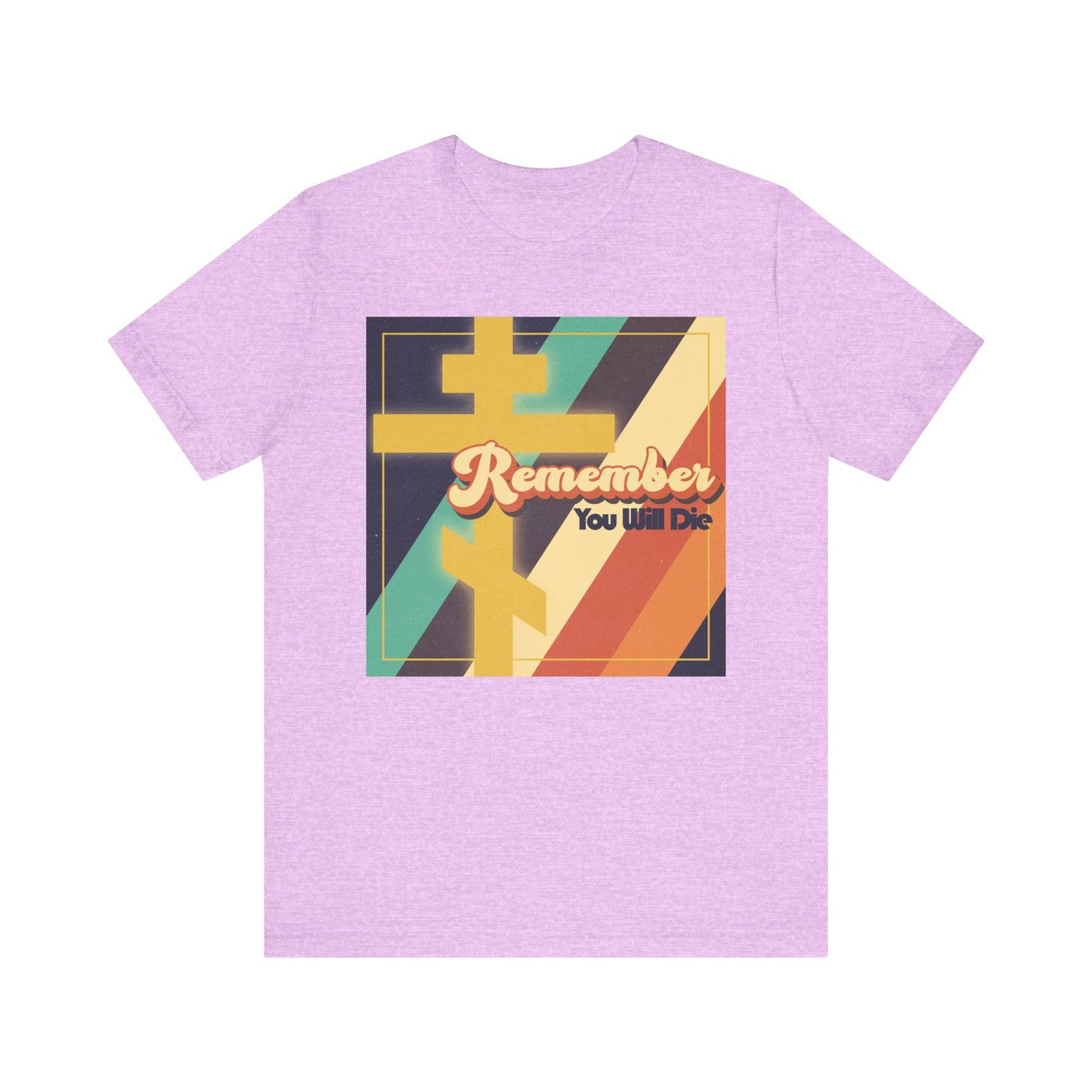 Heather Prism Lilac tee featuring ‘Remember You Will Die’ in 70s-inspired colorful typography with retro stripes, yellow shapes, and an Orthodox cross—its design inspired by the reflective spirit of a Tone 1 Tuesday Matins.