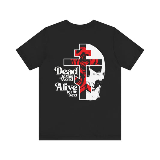 Black BACK PRINT 2-sided unisex tee: “Dead to this World” text with Christian goth flower cross & skull on lightweight cotton. Symbolizes spiritual renunciation; branded front. Color: black.