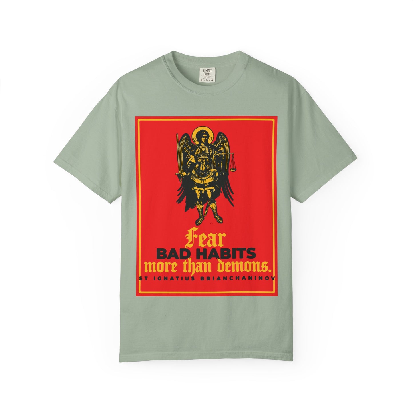 Bay heavyweight cotton unisex tee featuring a red and yellow iconographic graphic of Archangel Michael and the quote: “Fear bad habits more than demons” by St. Ignatius Brianchaninov—a reminder that the true spiritual war is often within.