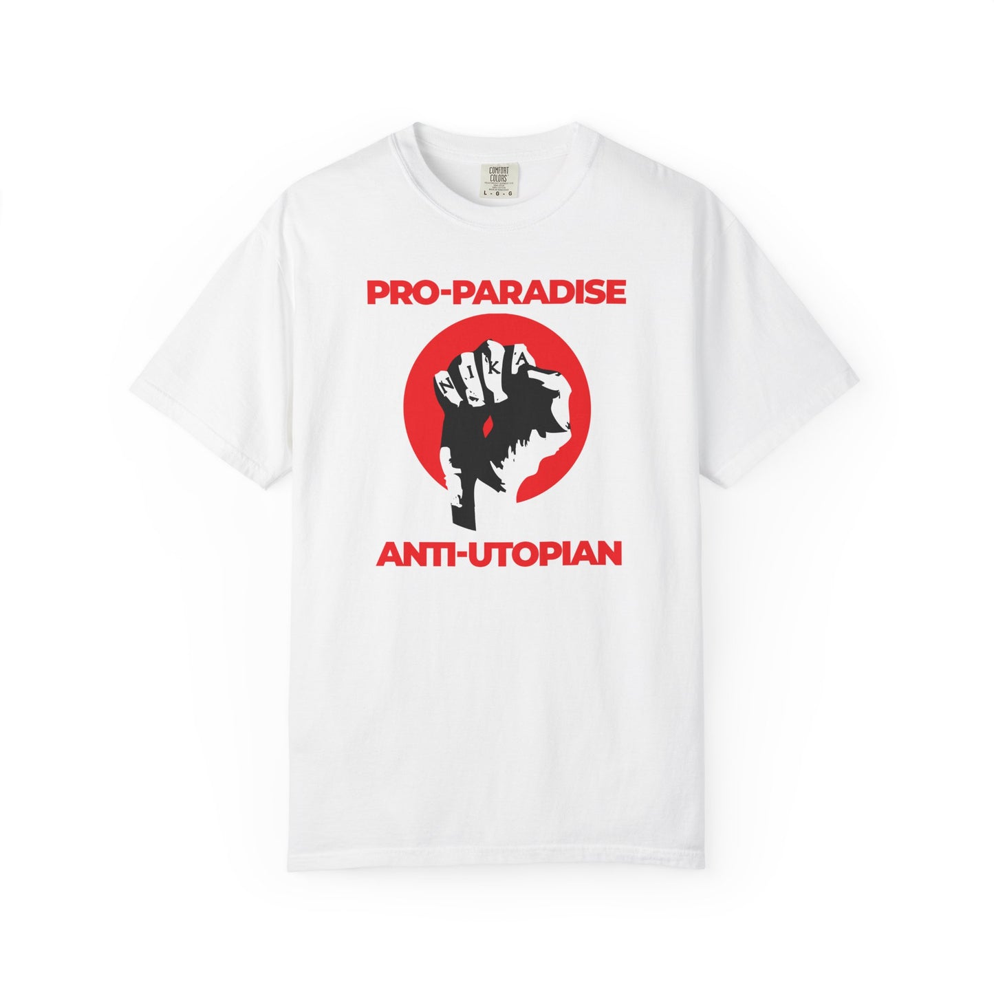 White heavyweight cotton unisex t-shirt featuring a raised fist and "Pro-Paradise Anti-Utopian" text—Jesus Christ crucified, NIKA symbol, and a call to resist the dominant secular paradigm.