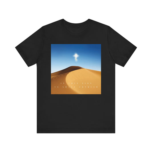 Black lightweight cotton unisex tee with a desert sun scene graphic and faint text: IN THIS SIGN YE SHALL CONQUER. The Cross is the Might of Kings. Orthodox Christian design.