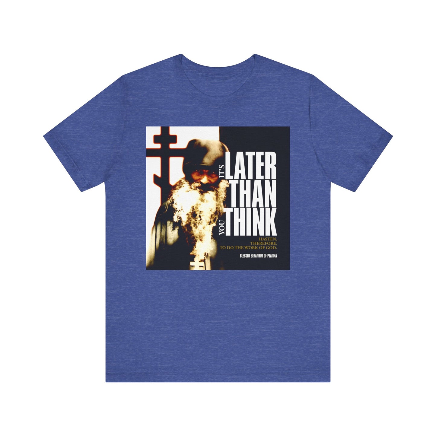 Heather True Royal T-shirt with a photo of St Seraphim Rose and modern cinematic poster typography: “It’s Later Than You Think.” Orthodox lightweight cotton unisex tee—a bold reminder to reflect on your way of life.
