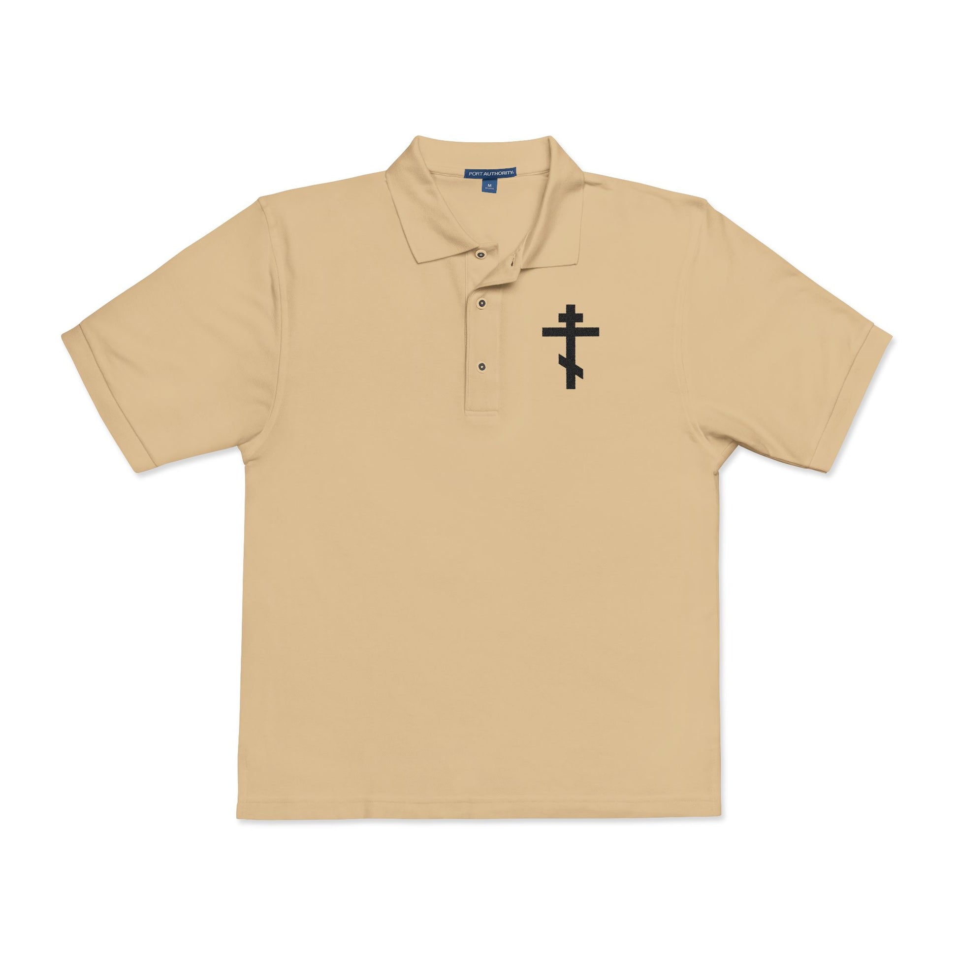 Stone polo shirt featuring an embroidered black Orthodox cross on the chest, inspired by Galatians 6:14: "May I never boast, except in the cross of our Lord Jesus Christ.