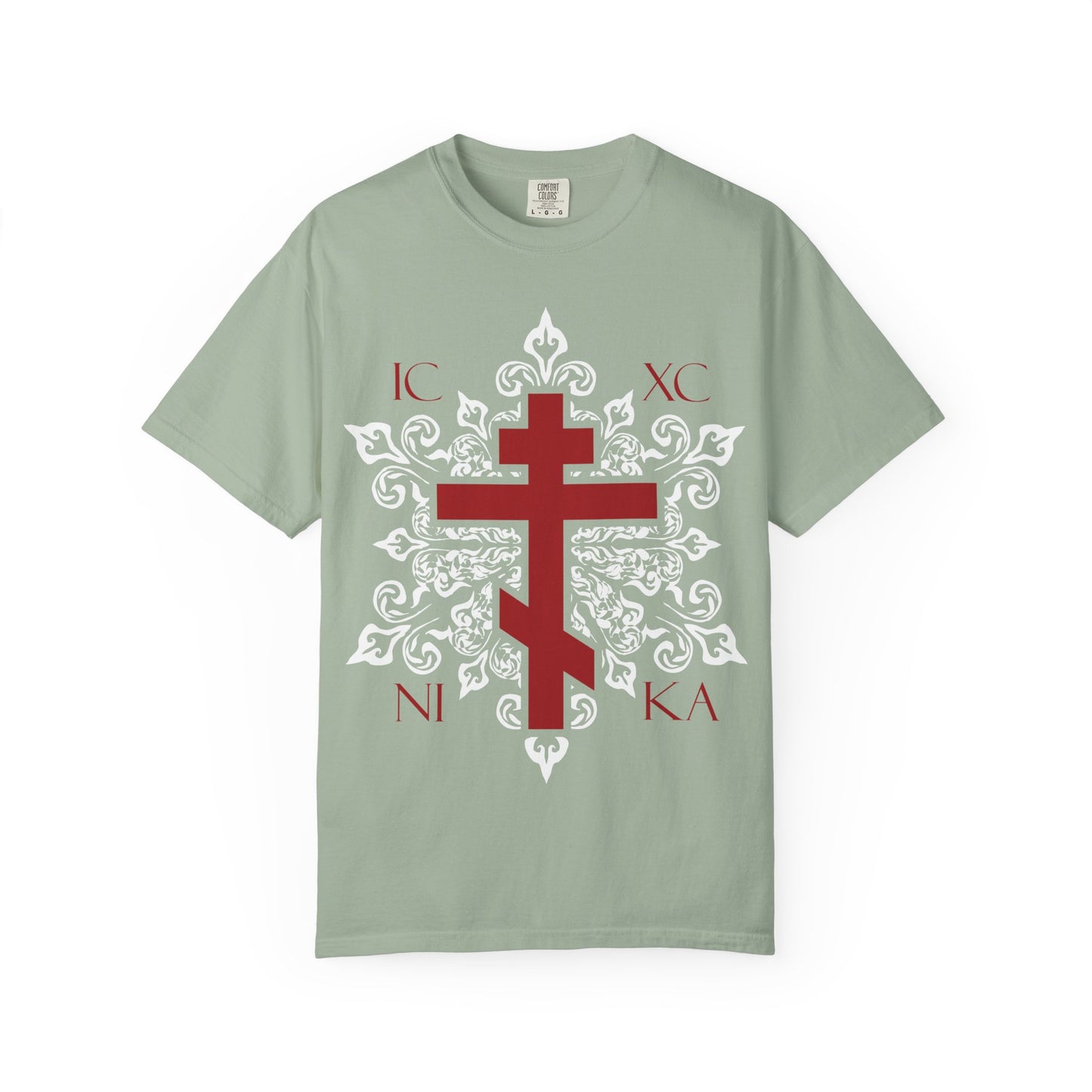 Bay-colored heavyweight cotton tee featuring a red Orthodox cross with the letters ICXC NIKA on an ornate white medieval floral design—a best-selling unisex shirt that beautifully symbolizes Adoration at the Cross and the promise of Paradise.