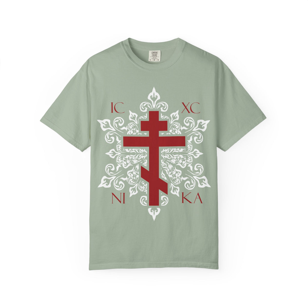 Bay-colored heavyweight cotton tee featuring a red Orthodox cross with the letters ICXC NIKA on an ornate white medieval floral design—a best-selling unisex shirt that beautifully symbolizes Adoration at the Cross and the promise of Paradise.